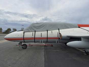 Photo of airplane with a cover over the cockpit.